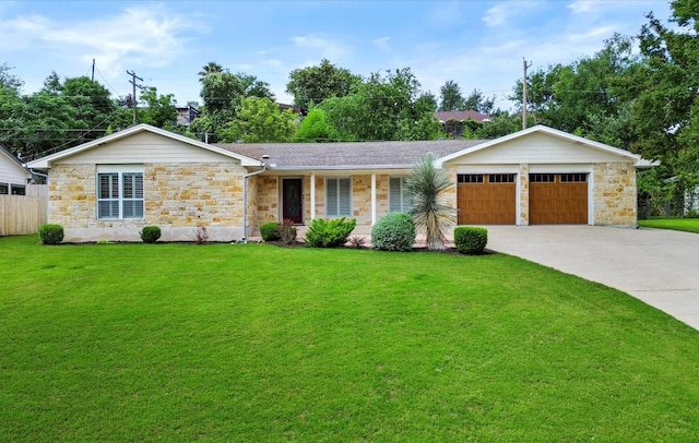 3601 Arrowhead Dr, Austin, TX 78731 - single story home with stone siding, an attached garage, and driveway