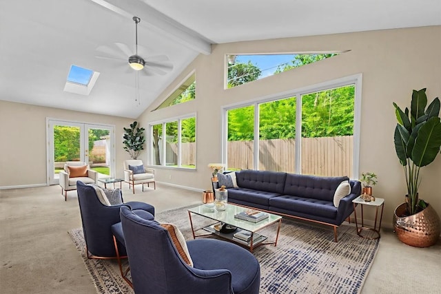3601 Arrowhead Dr, Austin, TX 78731 - carpeted living room with baseboards, a ceiling fan, beam ceiling, a skylight, and high vaulted ceiling