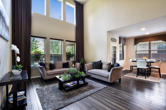 624 Purtis Creek Ln, Georgetown, TX 78628 - living area featuring a high ceiling, healthy amount of natural light, dark wood finished floors, baseboards, and recessed lighting
