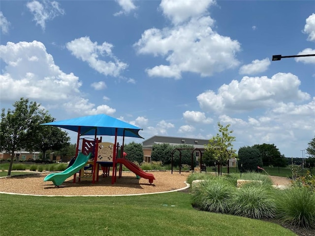624 Purtis Creek Ln, Georgetown, TX 78628 - community play area featuring a lawn