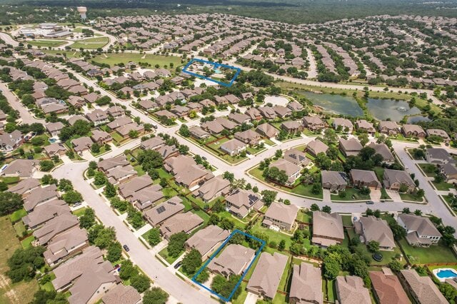 624 Purtis Creek Ln, Georgetown, TX 78628 - aerial view of property's location featuring property boundaries highlighted, nearby suburban area, and a nearby body of water