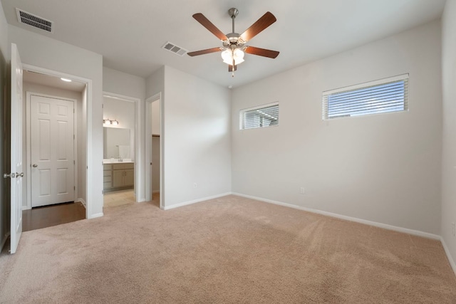 1416 Reprise Bnd, Round Rock, TX 78681 - unfurnished bedroom with carpet, baseboards, ensuite bathroom, and ceiling fan