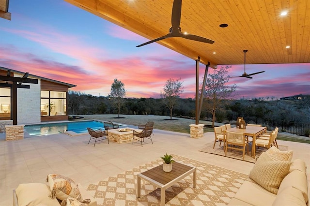 1047 Overlook Pkwy, Horseshoe Bay, TX 78657 - view of patio / terrace with an outdoor fire pit, outdoor dining space, and a ceiling fan