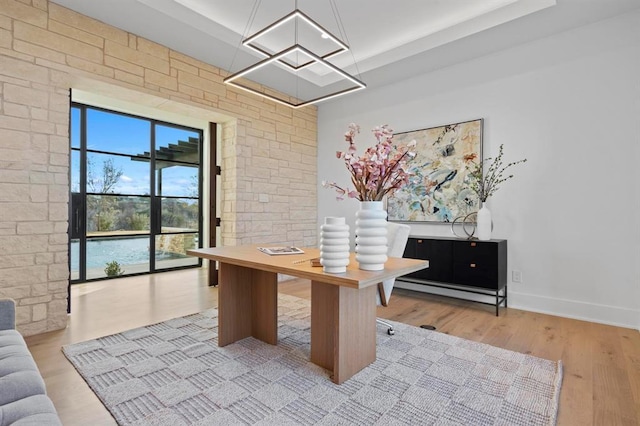 1047 Overlook Pkwy, Horseshoe Bay, TX 78657 - office area featuring wood finished floors and a chandelier