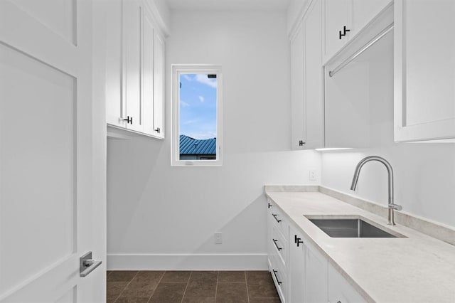 1047 Overlook Pkwy, Horseshoe Bay, TX 78657 - washroom with a sink and baseboards