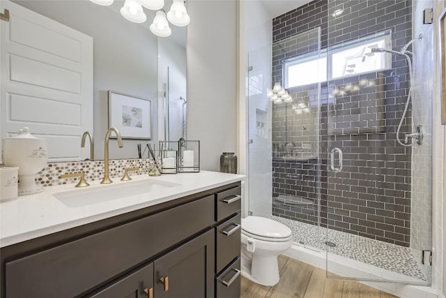 12404 Cardinal Flower Dr, Austin, TX 78739 - bathroom featuring vanity, a shower stall, and wood finished floors