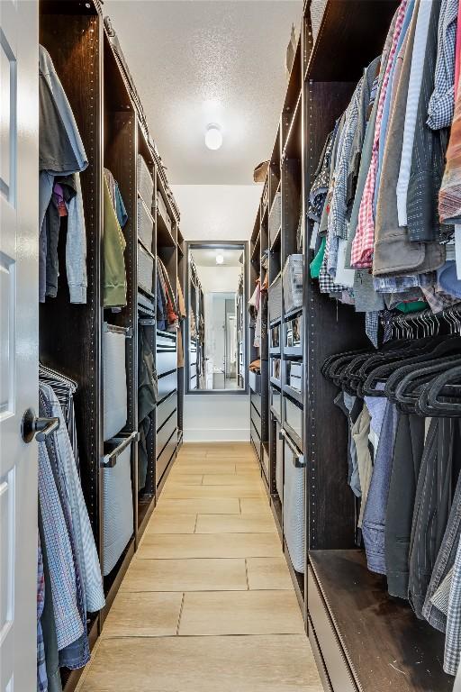 12404 Cardinal Flower Dr, Austin, TX 78739 - walk in closet featuring light wood-style floors