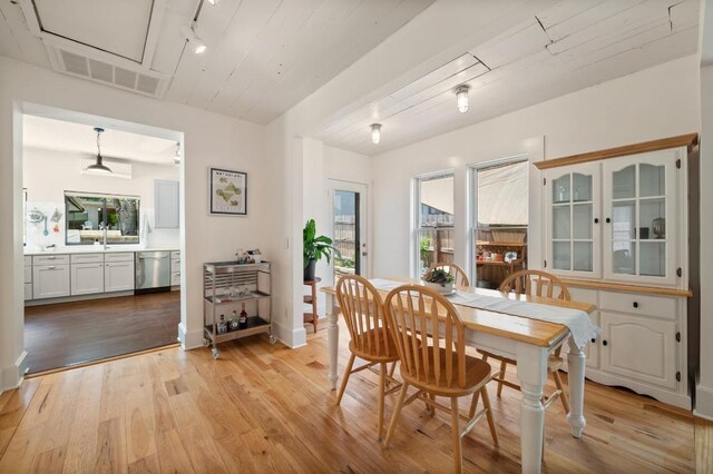 1700 S 3rd St, Austin, TX 78704 - dining room with light wood-style floors, baseboards, and track lighting