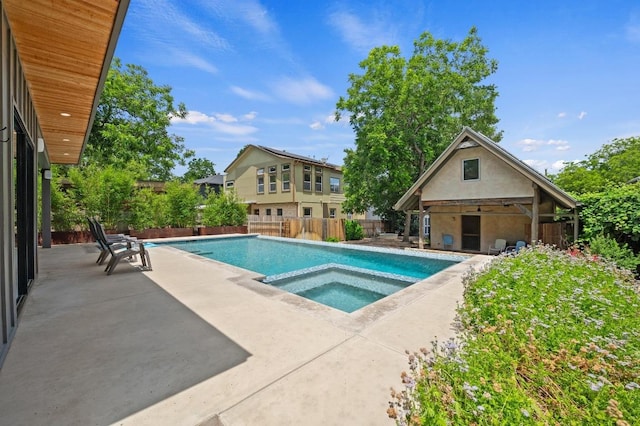 1700 S 3rd St, Austin, TX 78704 - view of swimming pool with a patio area, a pool with connected hot tub, and an outbuilding