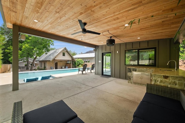 1700 S 3rd St, Austin, TX 78704 - view of pool with a sink, a patio, an outbuilding, and a ceiling fan