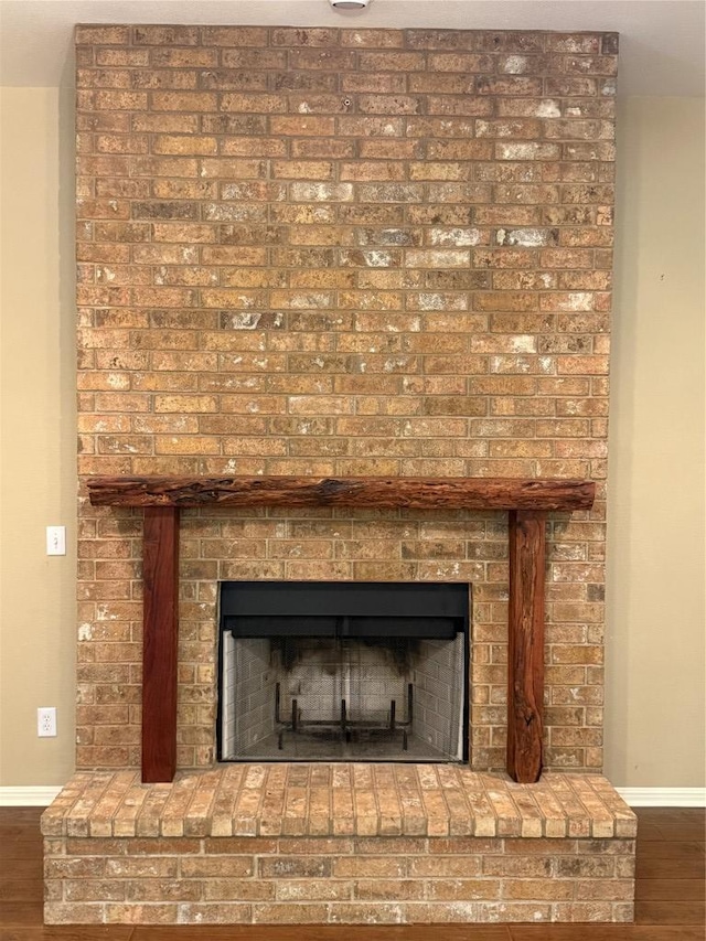 2222 Garden Gate Cir, New Braunfels, TX 78130 - detailed view of a brick fireplace and wood finished floors