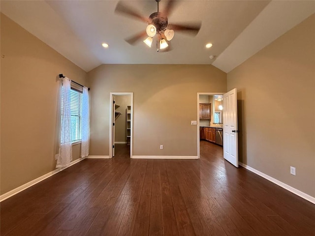 2222 Garden Gate Cir, New Braunfels, TX 78130 - unfurnished bedroom with lofted ceiling, a spacious closet, dark wood-style floors, a ceiling fan, and recessed lighting