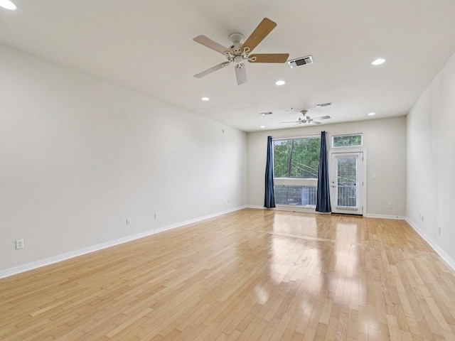 2931 E 12th St Unit 206, Austin, TX 78702 - spare room featuring baseboards, light wood-style flooring, ceiling fan, and recessed lighting