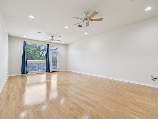 2931 E 12th St Unit 206, Austin, TX 78702 - empty room featuring light wood-style floors, ceiling fan, baseboards, and recessed lighting