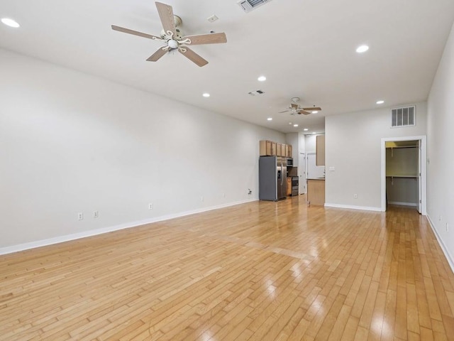 2931 E 12th St Unit 206, Austin, TX 78702 - unfurnished living room featuring ceiling fan, light wood-type flooring, baseboards, and recessed lighting