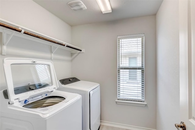 14400 Mccoy Loop, Austin, TX 78717 - laundry room featuring separate washer and dryer and baseboards