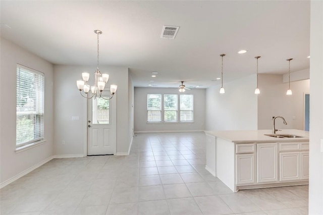 14400 Mccoy Loop, Austin, TX 78717 - kitchen featuring a sink, light countertops, open floor plan, recessed lighting, and pendant lighting