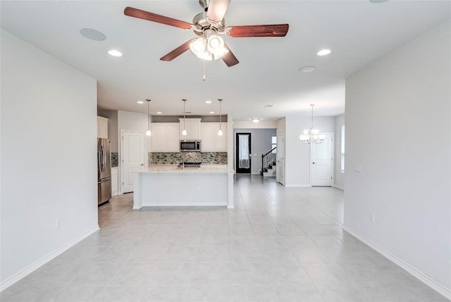 14400 Mccoy Loop, Austin, TX 78717 - unfurnished living room with recessed lighting, ceiling fan, baseboards, and a chandelier