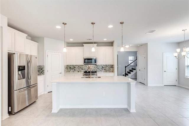14400 Mccoy Loop, Austin, TX 78717 - kitchen featuring stainless steel appliances, tasteful backsplash, light countertops, a sink, and recessed lighting