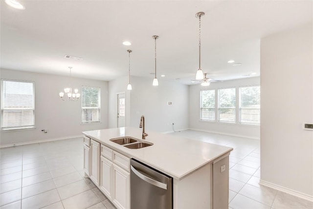 14400 Mccoy Loop, Austin, TX 78717 - kitchen featuring stainless steel dishwasher, light tile patterned floors, a sink, ceiling fan, and an island with sink