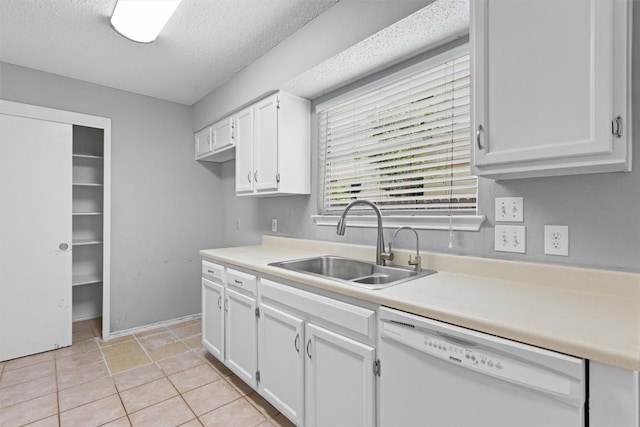 913 Dover Pass, Cedar Park, TX 78613 - kitchen featuring dishwasher, a sink, white cabinets, light countertops, and a textured ceiling