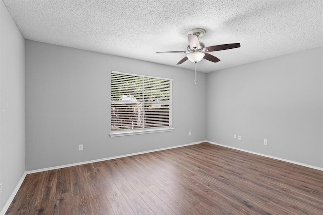 913 Dover Pass, Cedar Park, TX 78613 - empty room with a ceiling fan, wood finished floors, a textured ceiling, and baseboards