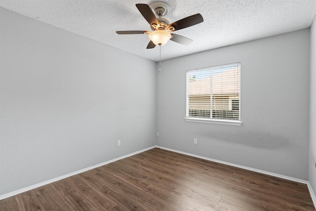 913 Dover Pass, Cedar Park, TX 78613 - unfurnished room with wood finished floors, ceiling fan, baseboards, and a textured ceiling