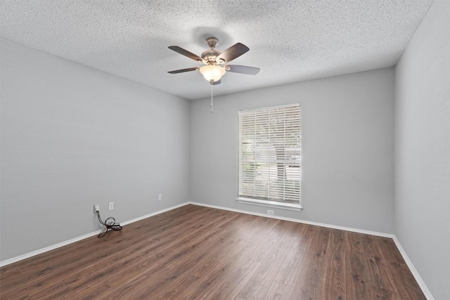 913 Dover Pass, Cedar Park, TX 78613 - spare room with dark wood-type flooring, ceiling fan, a textured ceiling, and baseboards