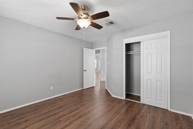 913 Dover Pass, Cedar Park, TX 78613 - unfurnished bedroom with wood finished floors, a closet, baseboards, ceiling fan, and a textured ceiling