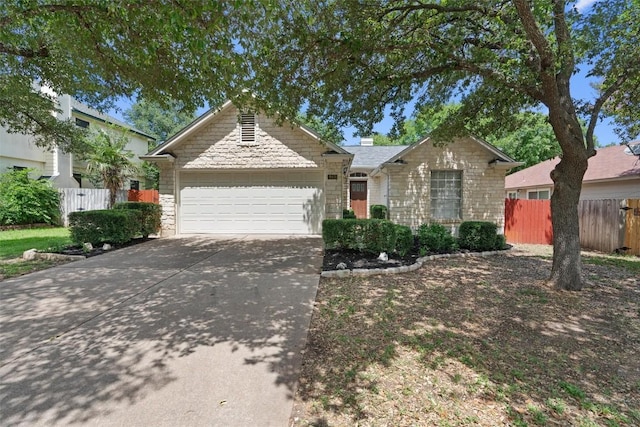 913 Dover Pass, Cedar Park, TX 78613 - view of front of house featuring concrete driveway, an attached garage, and stone siding