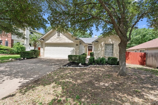 913 Dover Pass, Cedar Park, TX 78613 - view of front facade with stone siding, an attached garage, and driveway