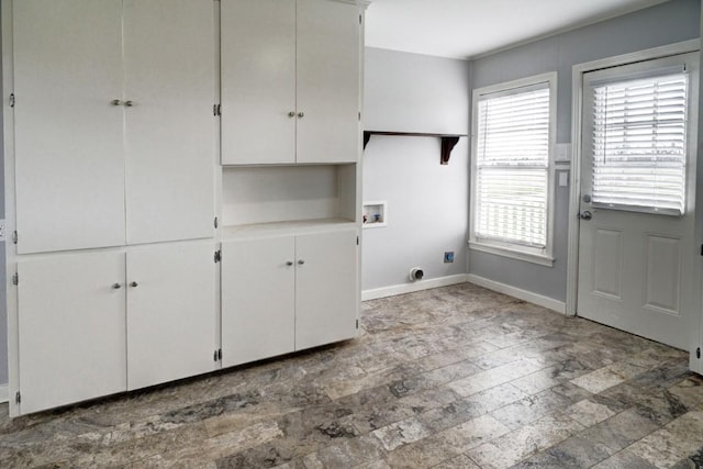 TBD-TRACT2 Rabbs Prairie Rd, La Grange, TX 78945 - laundry area with cabinet space, electric dryer hookup, washer hookup, baseboards, and stone finish floors
