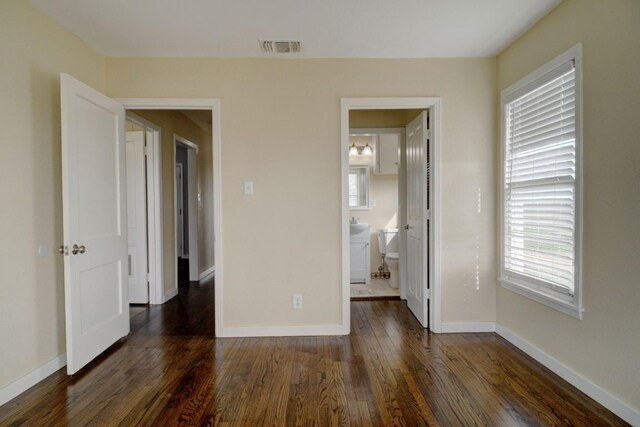 TBD-TRACT2 Rabbs Prairie Rd, La Grange, TX 78945 - unfurnished bedroom featuring dark wood-style flooring, baseboards, and ensuite bath
