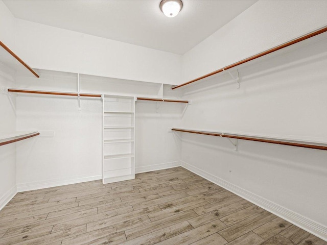 10110 Echoridge Dr, Austin, TX 78750 - walk in closet featuring wood finished floors