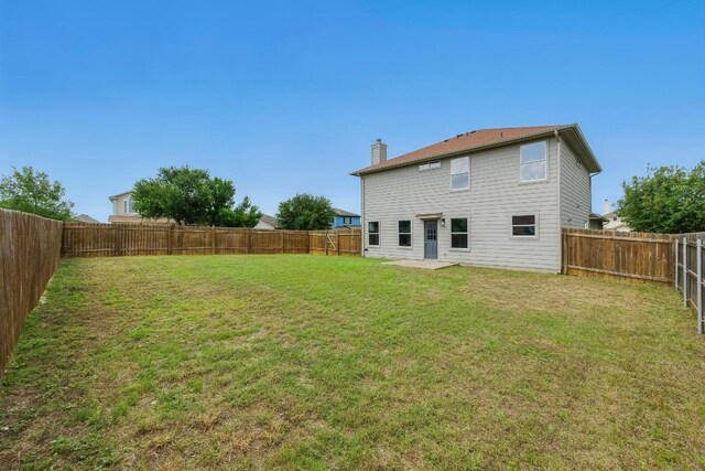 339 Precipice Way, Georgetown, TX 78626 - back of house with a chimney