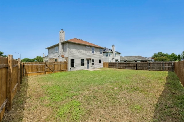 339 Precipice Way, Georgetown, TX 78626 - back of property with a chimney