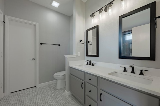 339 Precipice Way, Georgetown, TX 78626 - full bathroom with double vanity, toilet, and baseboards