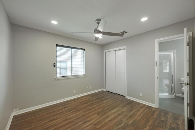 339 Precipice Way, Georgetown, TX 78626 - unfurnished bedroom featuring dark wood-style flooring, baseboards, a closet, recessed lighting, and ensuite bath