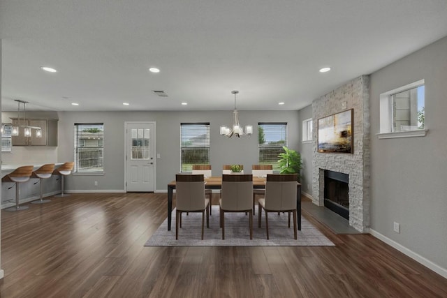 339 Precipice Way, Georgetown, TX 78626 - dining room with healthy amount of natural light, dark wood finished floors, a chandelier, baseboards, and recessed lighting