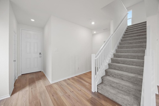 3917 Torraca Ln, Round Rock, TX 78665 - stairway with wood finished floors and recessed lighting