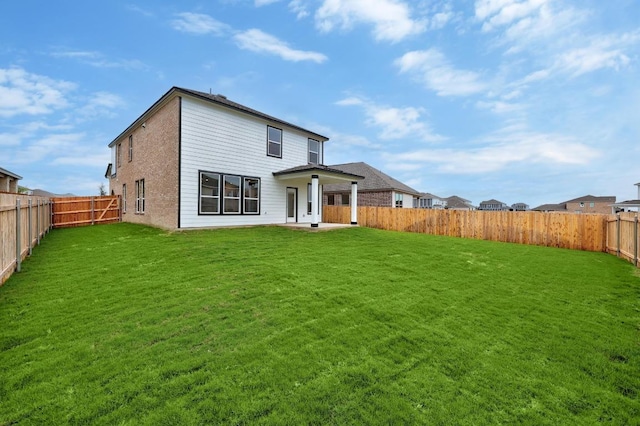 3917 Torraca Ln, Round Rock, TX 78665 - rear view of house with a fenced backyard, brick siding, and a patio area