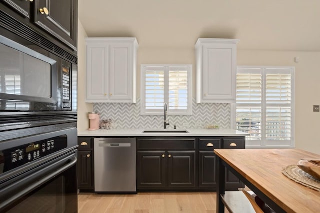 38 White Magnolia Cir, Austin, TX 78734 - kitchen featuring black appliances, a sink, white cabinets, and decorative backsplash
