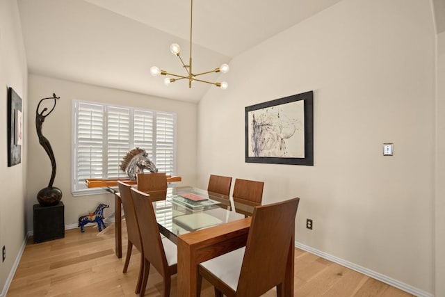 38 White Magnolia Cir, Austin, TX 78734 - dining space featuring a chandelier, light wood finished floors, vaulted ceiling, and baseboards