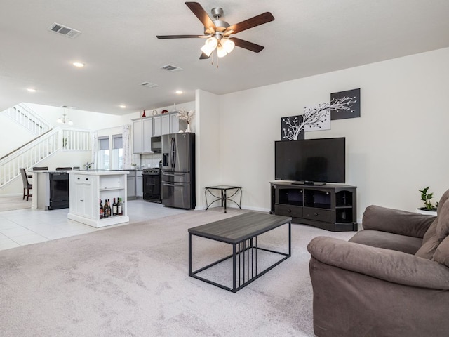1213 Whipple Tree Trl, Georgetown, TX 78626 - living room featuring a ceiling fan, stairs, light colored carpet, light tile patterned floors, and recessed lighting