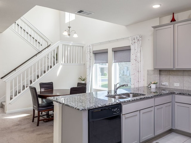 1213 Whipple Tree Trl, Georgetown, TX 78626 - kitchen with dishwasher, gray cabinetry, light stone countertops, decorative backsplash, and decorative light fixtures