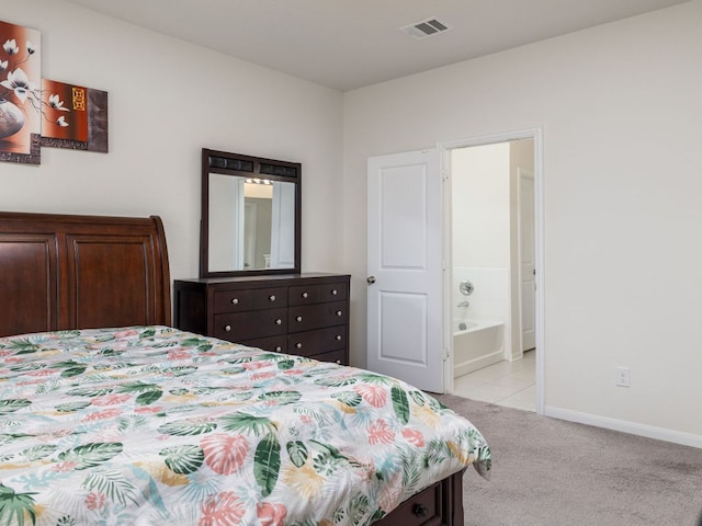 1213 Whipple Tree Trl, Georgetown, TX 78626 - bedroom featuring light colored carpet and ensuite bath