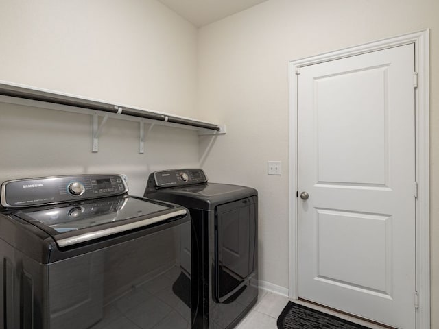 1213 Whipple Tree Trl, Georgetown, TX 78626 - laundry room with washing machine and dryer and light tile patterned floors