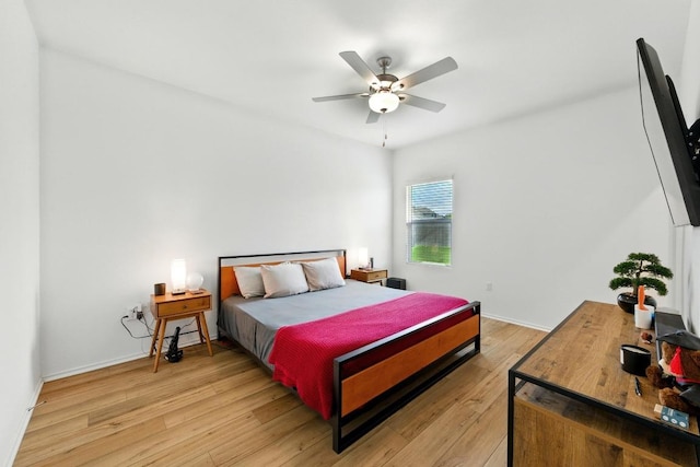 7506 Grenadine Bloom Bnd, Del Valle, TX 78617 - bedroom with light wood finished floors and a ceiling fan