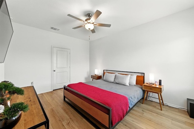 7506 Grenadine Bloom Bnd, Del Valle, TX 78617 - bedroom with light wood-style flooring and a ceiling fan