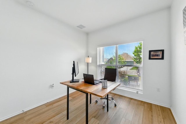 7506 Grenadine Bloom Bnd, Del Valle, TX 78617 - home office featuring light wood-style flooring and baseboards